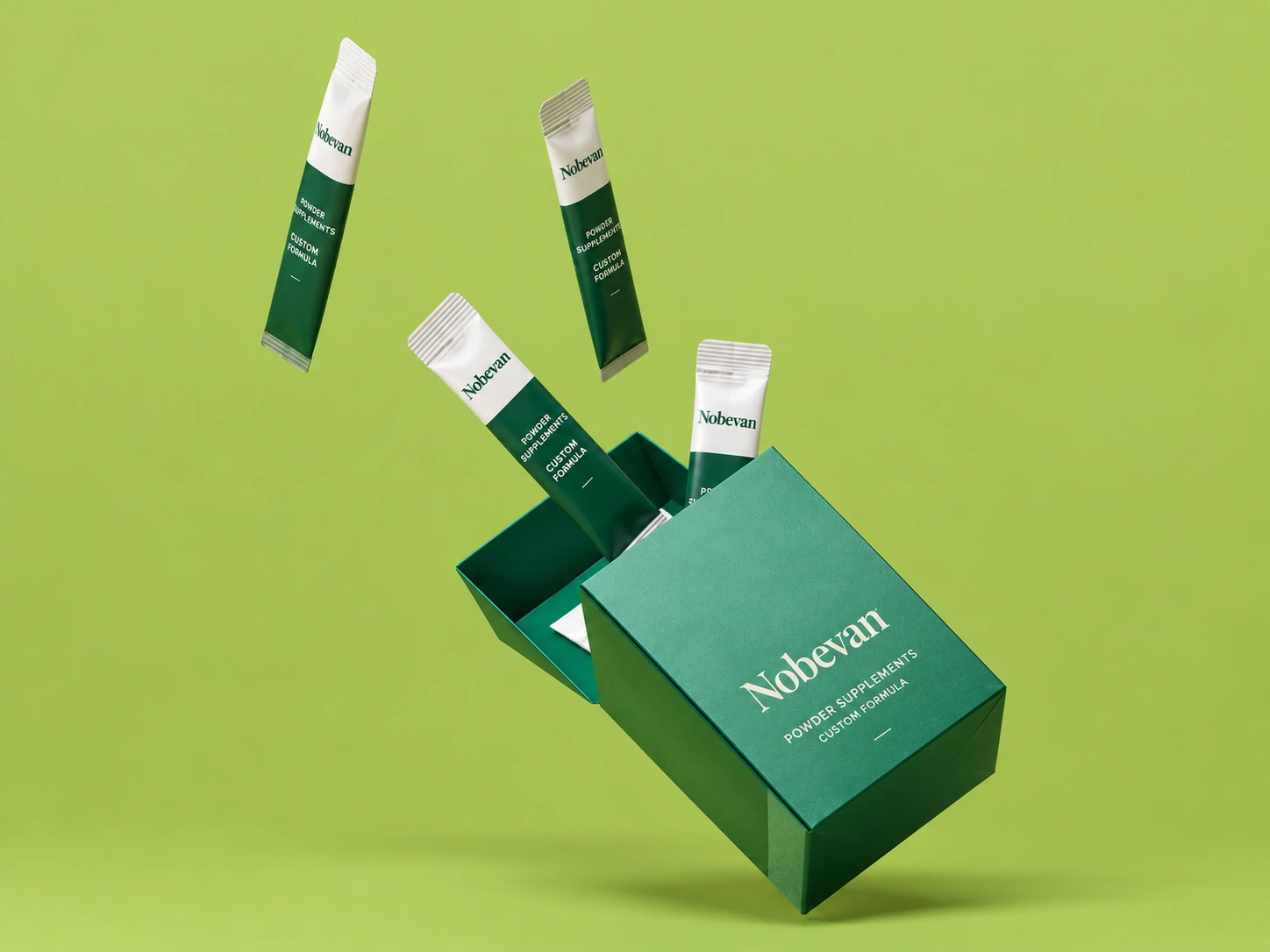 Nobevan powder supplement sticks and packaging on a neutral background
